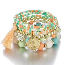 Multi-layered Pearl Bracelet with Coin Charm and Tassel Detail