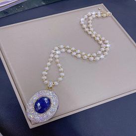 Ожерелье из натурального пресноводного жемчуга с синим камнем и цепочкой из циркона - модные украшения в стиле французского шика