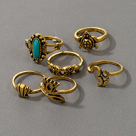 Ocean-inspired 6-piece set of gold rings with turtle shell, turquoise, and leaf accents for women