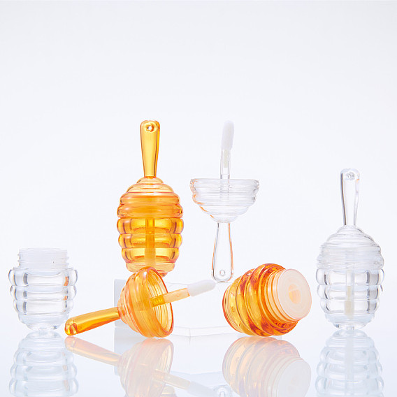 Botella vacía de brillo de labios de plástico abs transparente con forma de colmena, mini bote de lápiz labial recargable con raspador
