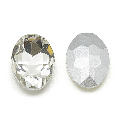Señaló hacia cabujones de diamantes de imitación de cristal, facetados, oval