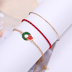Bracelet à breloques de Noël à la mode avec plusieurs couches et père Noël, couronne, breloques bonhomme de neige et traîneau
