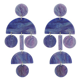 Acrylic acetate jewelry set with circular, semi-circular and rectangular pendants and earrings.