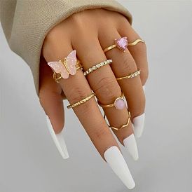 Комплект нежно-розовых колец-бабочек с кольцами в виде сердечек с бриллиантами - 8 штук