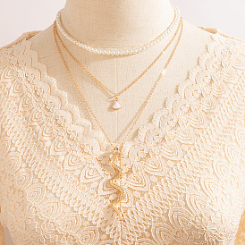 Collier serpent coquillage chic avec perles - chaîne de cou multicouche élégante pour femme