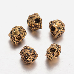 Oro Antiguo Abalorios de aleación de estilo tibetano, cráneo, oro antiguo, 9x6x10 mm, agujero: 1 mm