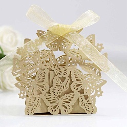 Verge D'or Pâle Boîtes en carton de bonbons de mariage pliantes créatives, petits coffrets cadeaux en papier, papillon creux avec ruban, verge d'or pale, pli: 6.3x4x4 cm