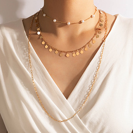 Collier multicouche de perles et de métal géométrique avec pompons en chaîne