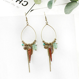 Bold and Unique Alloy Tassel Earrings with Irregular Pendant Design