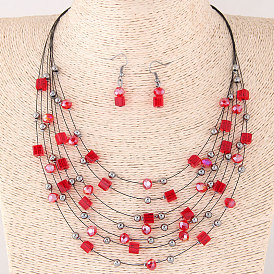 Bohemian-style multi-layered crystal necklace and earrings set for a fashionable look.