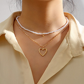Layered Pearl Necklace with Vintage Heart Pendant for Women's Fashion Statement