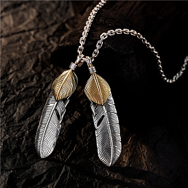 Винтажное серебряное ожерелье с перьями — длинная цепочка-свитер с золотистым кулоном Хироси Такахаси.