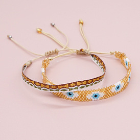 Bracelet mauvais œil en perles miyuki foncé serti de bandes tissées empilables par gosboho