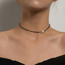 Collier de perles de cristal noir avec breloque fleur - fermoir ot chic et simple