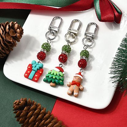 Подвеска в стиле рождественской тематики из смолы и полимерной глины со стразами, с поворотными застежками сплава, пряничный человечек, рождественская елка и подарочная коробка