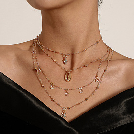 Superbe collier pendentif étoile à six branches avec des diamants étincelants et des accents de coquillages vintage - parfait pour la mode hip hop féminine !