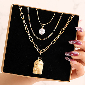 Multi-layered Alloy Necklace with Creative Pearl Relief Face Pendant