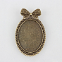 Support de cabochon en alliage , sans cadmium et sans plomb, assortiment d'apprêts avec clou en fer, ovale avec bowknot, plateau: 40x30 mm, 60x38x2 mm, broche: 0.6 mm