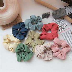 Sweet and versatile hair accessories - gentle fabric scrunchies in solid colors.