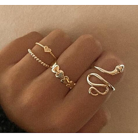 Enchanting Serpent Heart Rings Set - 4 Pieces of Unique and Minimalistic Jewelry