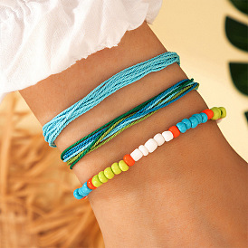 Bracelet multicouche bohème fait main serti de perles géométriques colorées et de perles de riz