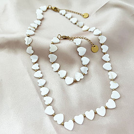 Ensemble de bijoux collier et bracelet en perles de nacre et d'acier en forme de cœur pour femme