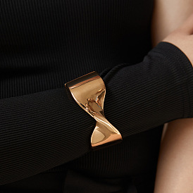 Minimalist Butterfly Bow Glossy Fashion Bracelet - Twisted Design, Unique Bracelet, Cool Tone Jewelry.