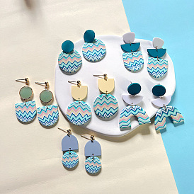 High-end color contrast irregular water ripple acrylic metal stitching soft pottery earrings female earrings
