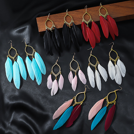 Серьги-подвески из сплава в виде конского глаза с пером., золотые