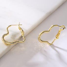 Vintage Heart-shaped Earrings for Women with High-end Design and Cold-tone Aesthetic