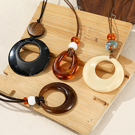 Кольцо из смолы, подвеска в форме капли, длинные цепочки с вощеным шнурком.