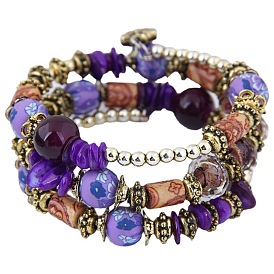 Boho-style multi-layered beaded bracelet with shell crystal accents.