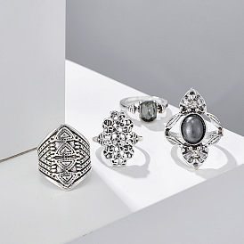 Vintage-inspired Geometric Ring Set with Intricate Cutout Totems and Gemstone Accents (4-Piece)