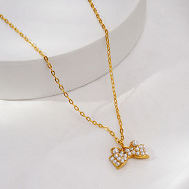 Elegantes collares con colgante de lazo de acero inoxidable con perla de imitación para mujer., dorado