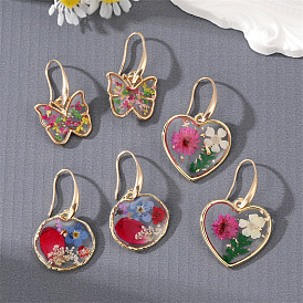 Boucles d'oreilles fleur éternelle transparente avec papillon coeur et motif floral géométrique pour un charme rustique