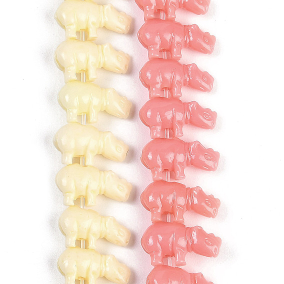 Нити резных бусин синтетического коралла, носорог