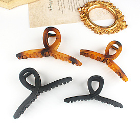 Elegant Hair Clip for Stylish Updo - Shark Jaw Plastic Clamp, Chic and Graceful.
