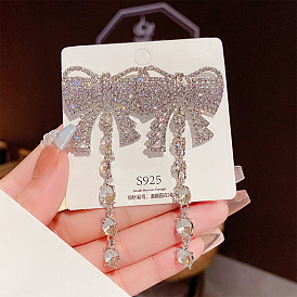 Exaggerated tassel earrings with diamond butterfly bow ear drops - temperament and style.