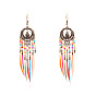 Bohemian Feather Tassel Earrings with Intricate Cutout Design