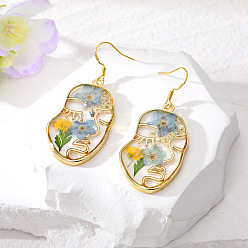 Golden face with light blue flower earrings (flat hook). Серьги из натуральных сухоцветов с креативным дизайном лица и смоляным покрытием