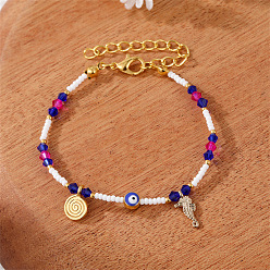 Two gold pendants with white and purple pearls. Colorful Pearl Flower Bracelet with Unique Design and Handmade Beads