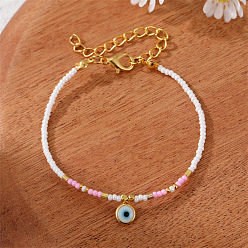 A white pearl and a gold pendant. Colorful Pearl Flower Bracelet with Unique Design and Handmade Beads