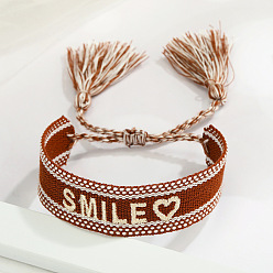 Burgundy-colored SMILE with a heart. Embroidered Tassel Bracelet with Personalized Alphabet Design - Fashionable Couple's Wristband in Multiple Styles