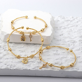 Chic and Elegant 18k Gold Plated Key Lock Bracelet for Women - Unique Design Hand Jewelry with Delicate Style by Xi Huan