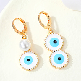 Vintage Asymmetrical Metal Pearl Devil Eye Earrings with Unique Circular Design for Women's Fashion Accessories