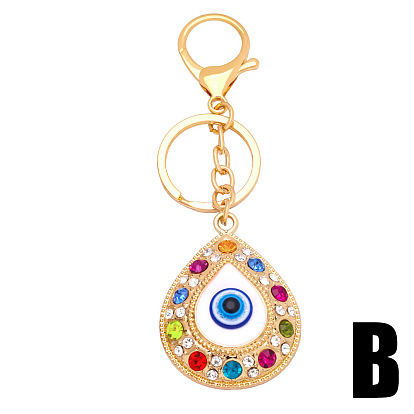 Colored rhinestone devil's eye metal keychain pendant creative small gift bag pendant kca36