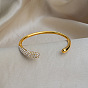 Bracelet jonc ouvert de luxe en acier inoxydable serti de micro-pavés de zirconiums cubiques transparents pour femme