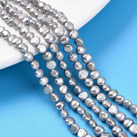 Нити из натурального культивированного пресноводного жемчуга, двух сторон полированной, окрашенные