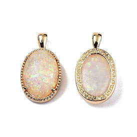 Pendentifs en résine imitation opale, avec accessoires en laiton plaqués or clair, charme ovale