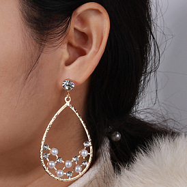 Fashionable Metal Water Drop Earrings with Hollowed-out Pearl Ear Jewelry for Women.